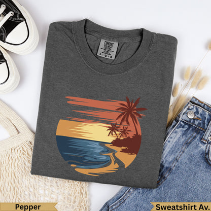 Dark grey Comfort Colors t-shirt with sunset beach graphic and text.