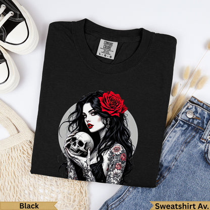 Black t-shirt with graphic of a woman holding a skull and wearing a red rose.