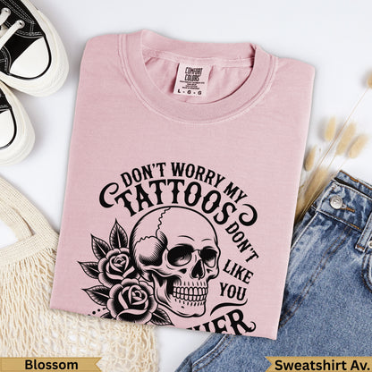 Pink Comfort Colors sweatshirt with skull, roses, and text "Don't worry my tattoos don't like you".