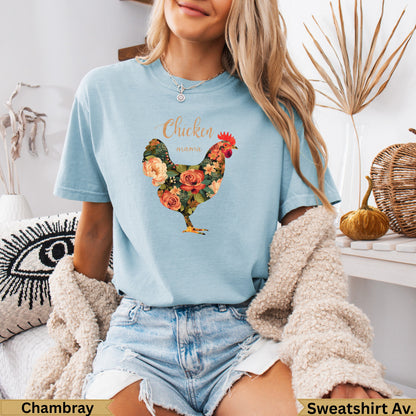 Light blue t-shirt with floral chicken graphic and "Chicken Mama" text.