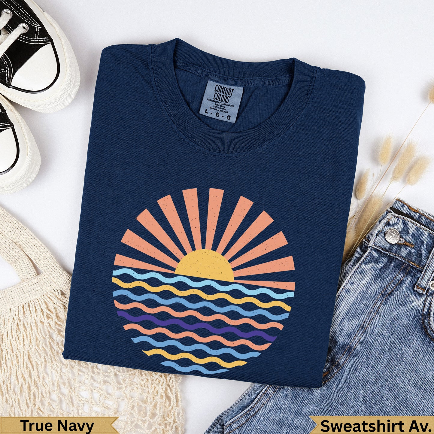 Navy t-shirt with a sunburst over wavy lines design.