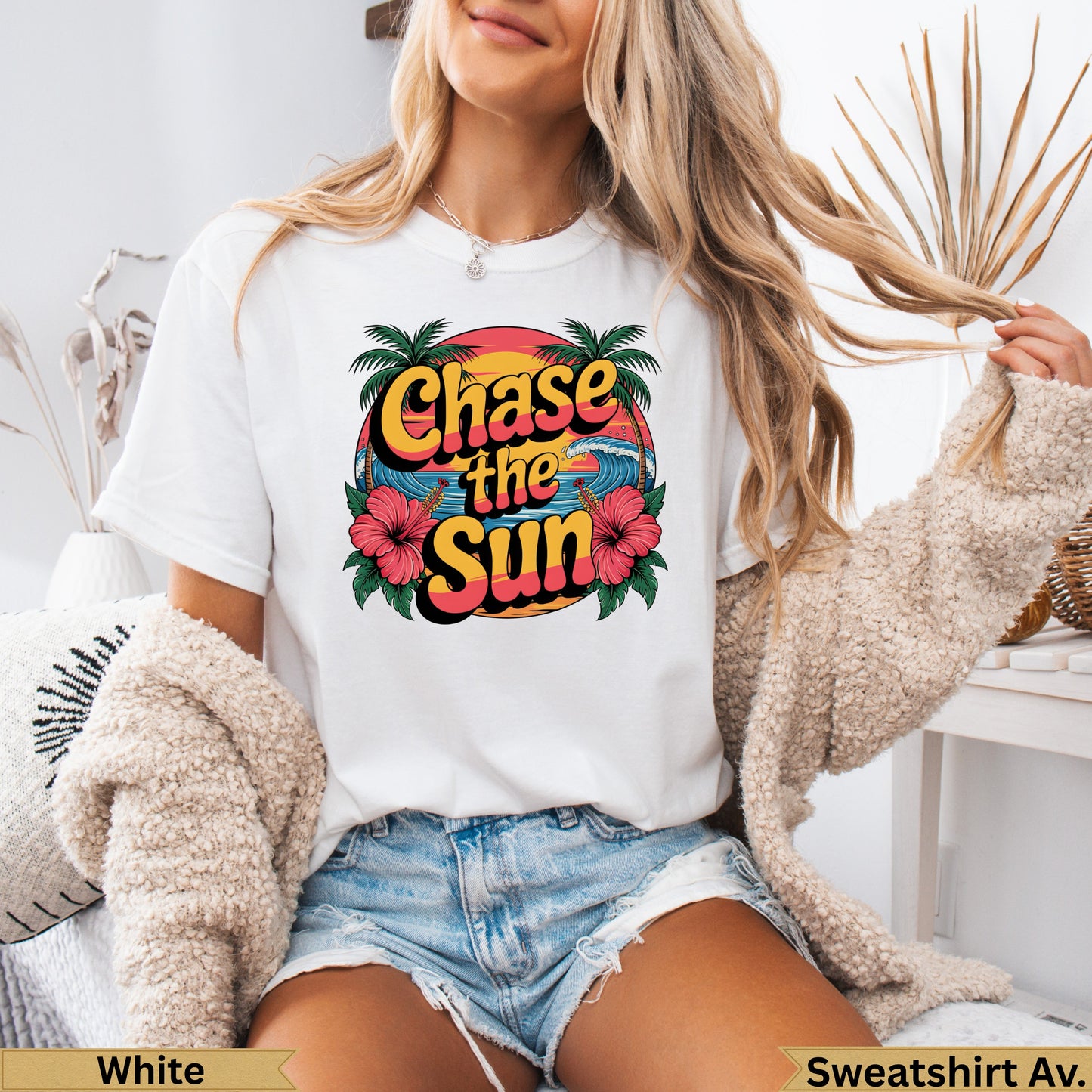 White t-shirt with "Chase the Sun" text, palm trees, and waves graphic.