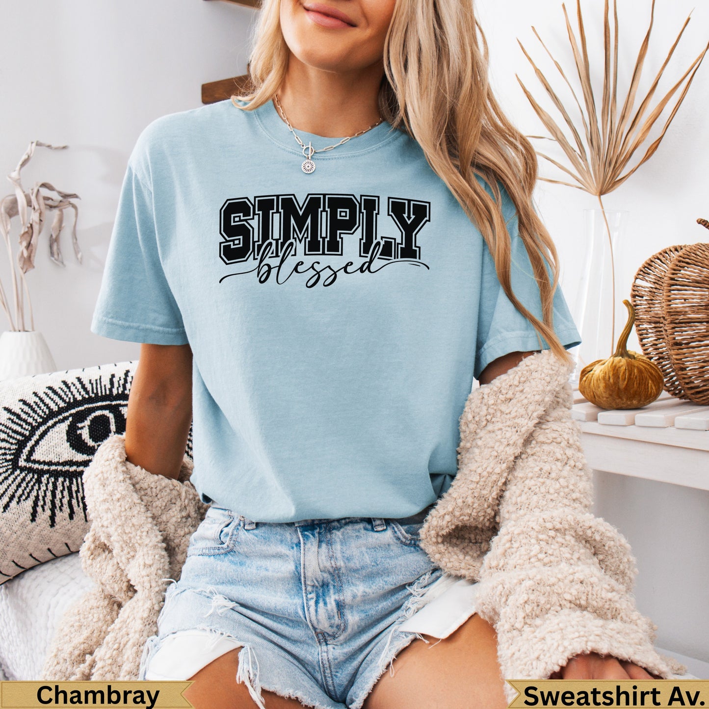 Light blue t-shirt with "SIMPLY blessed" text, worn by a model.