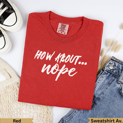 Red t-shirt with "HOW ABOUT... nope" in white text, beside jeans and shoes.