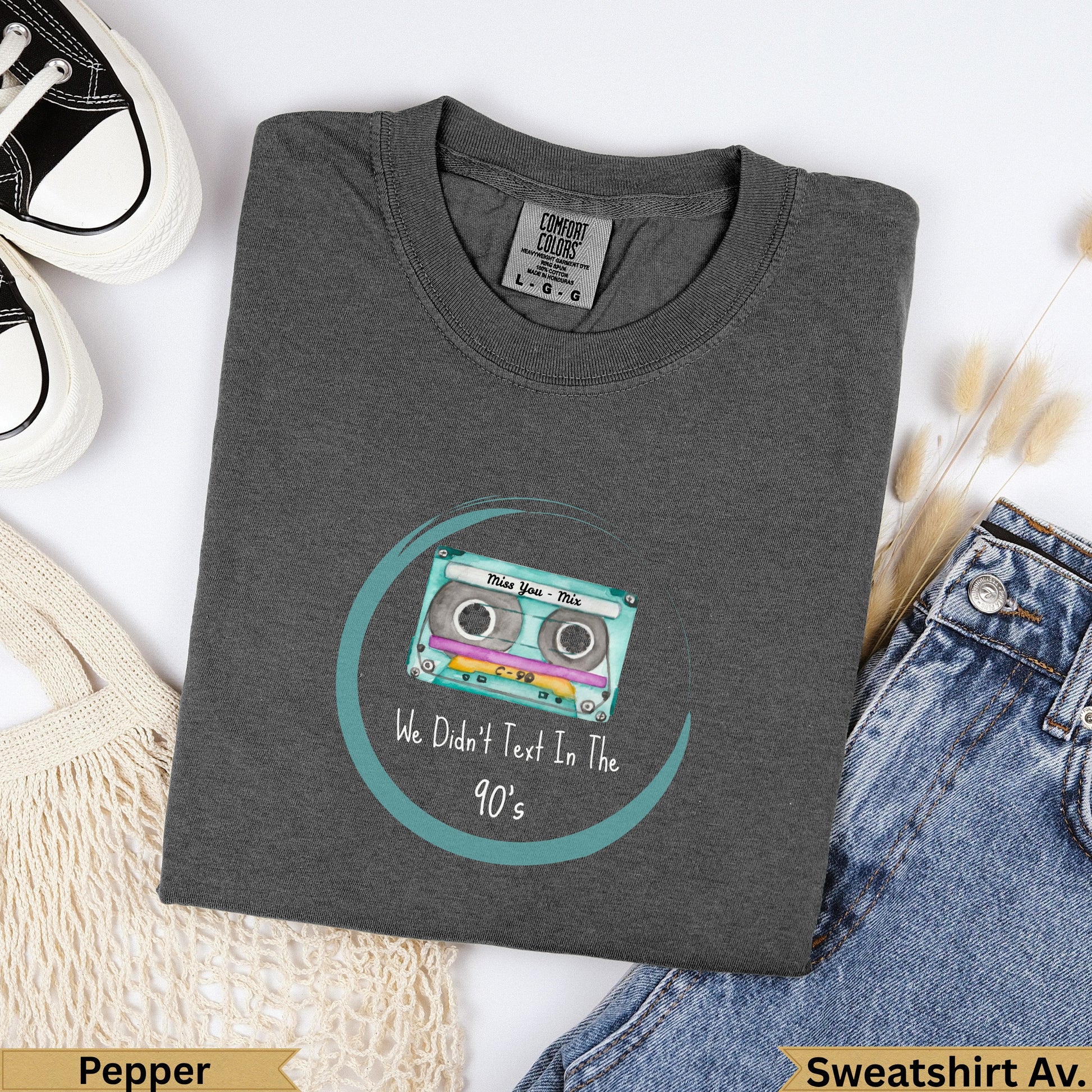 Dark gray t-shirt with "We Didn't Text In The 90's" and a cassette tape.
