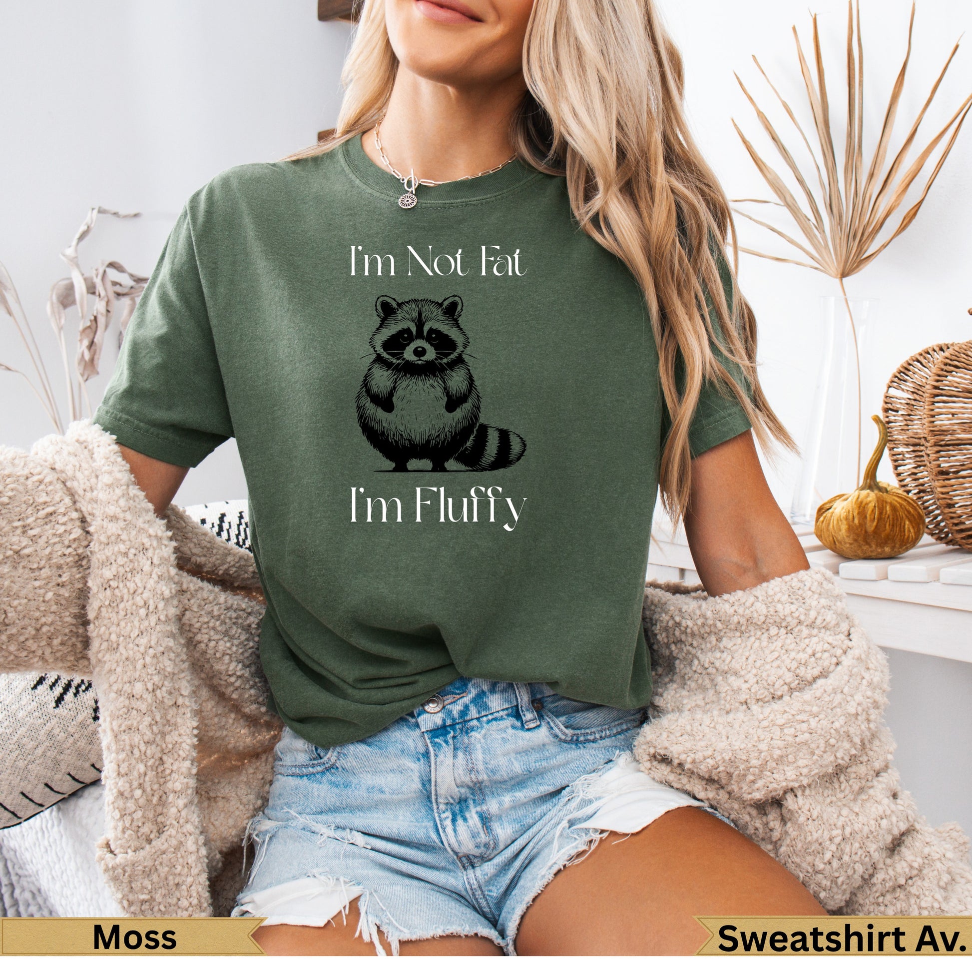 Green t-shirt with raccoon graphic and text "I'm Not Fat I'm Fluffy."