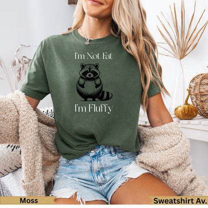 Green t-shirt with raccoon graphic and text "I'm Not Fat I'm Fluffy."
