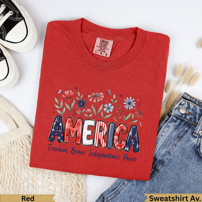 Red t-shirt with "AMERICA" graphic, "Freedom Brave Independence Power" text.