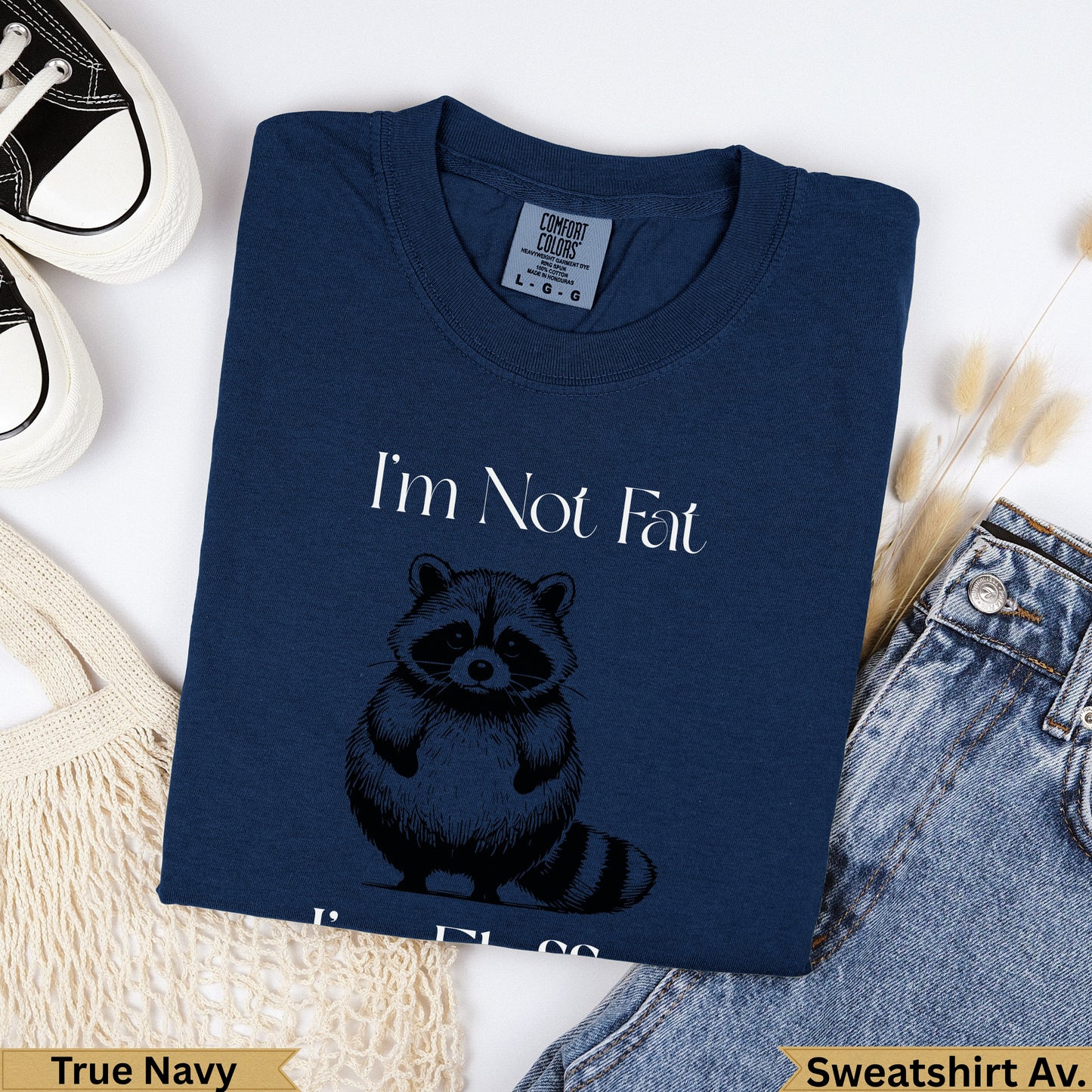 Navy sweatshirt with raccoon graphic and "I'm Not Fat" text.
