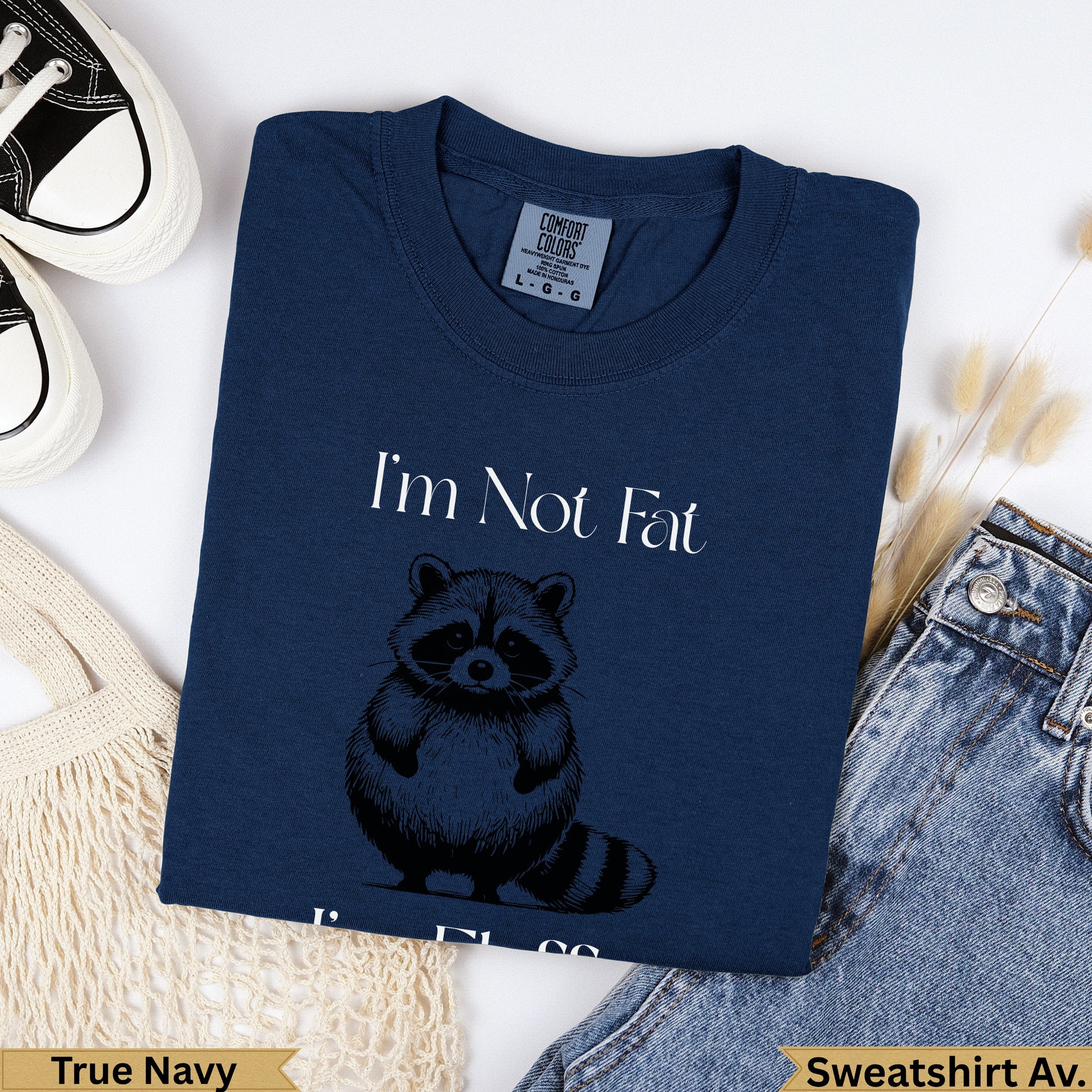 Navy sweatshirt with raccoon graphic and "I'm Not Fat" text.