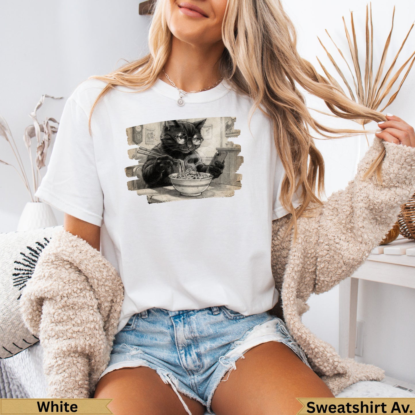 White t-shirt with black cat wearing glasses eating noodles graphic.