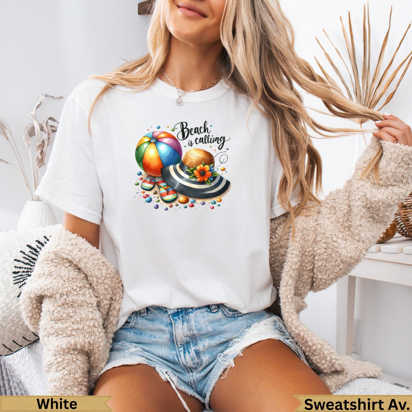 White t-shirt with watercolor beach ball, hat, and text "Beach is calling".