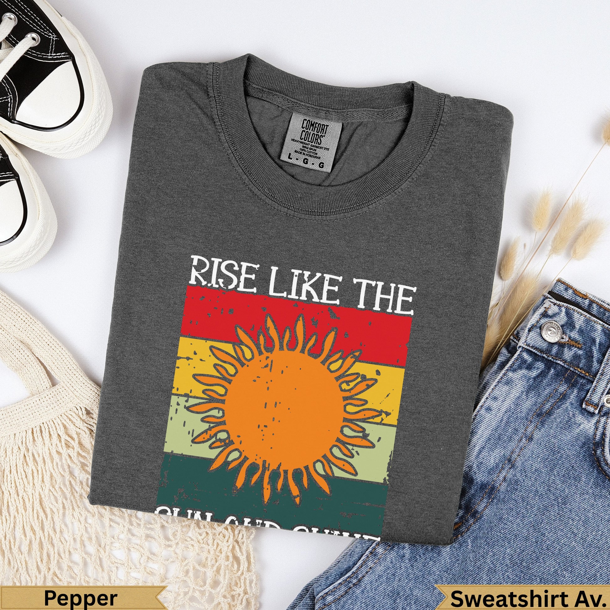 Dark gray Comfort Colors sweatshirt with "Rise Like the Sun" graphic.