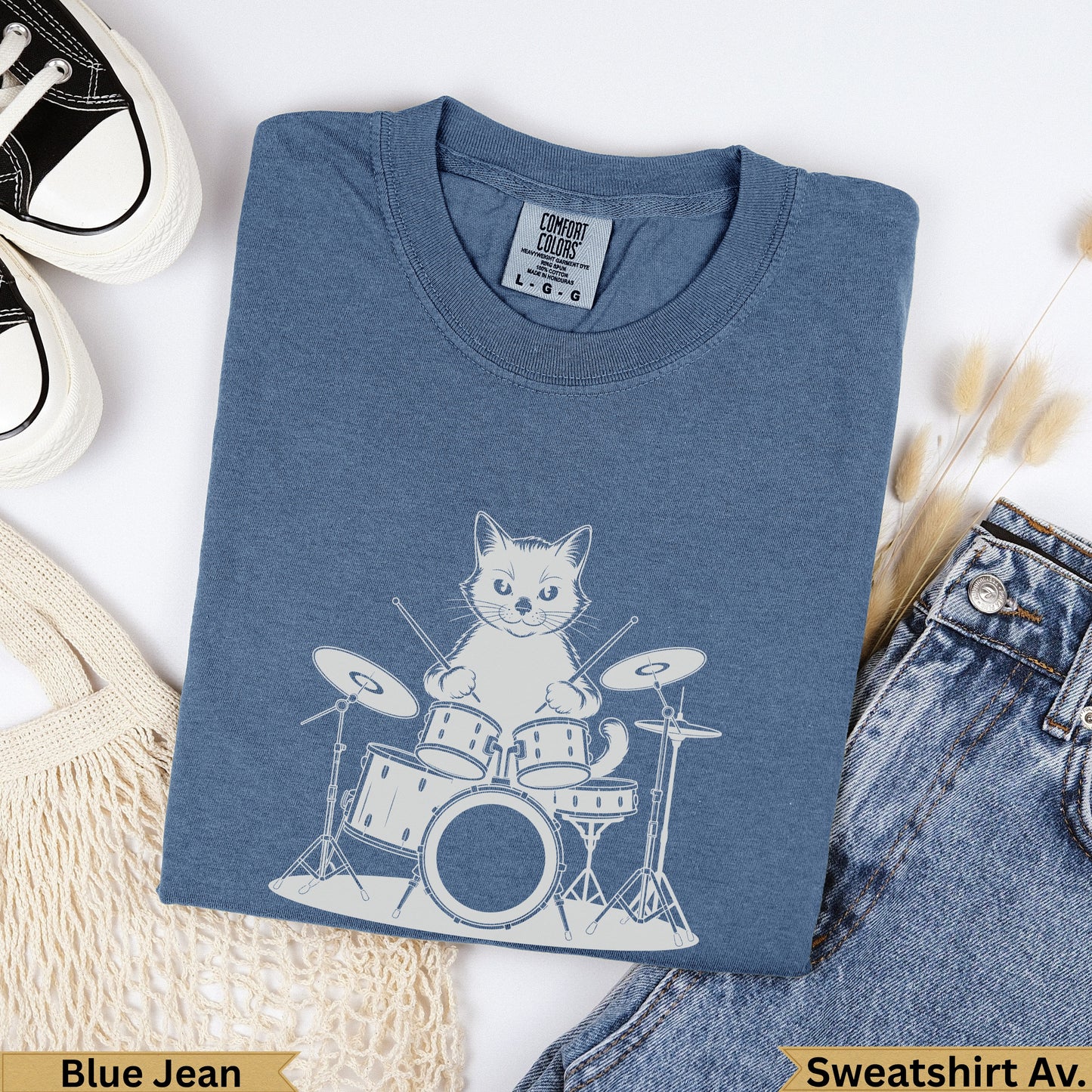 Blue Jean sweatshirt with a graphic of a cat playing drums.