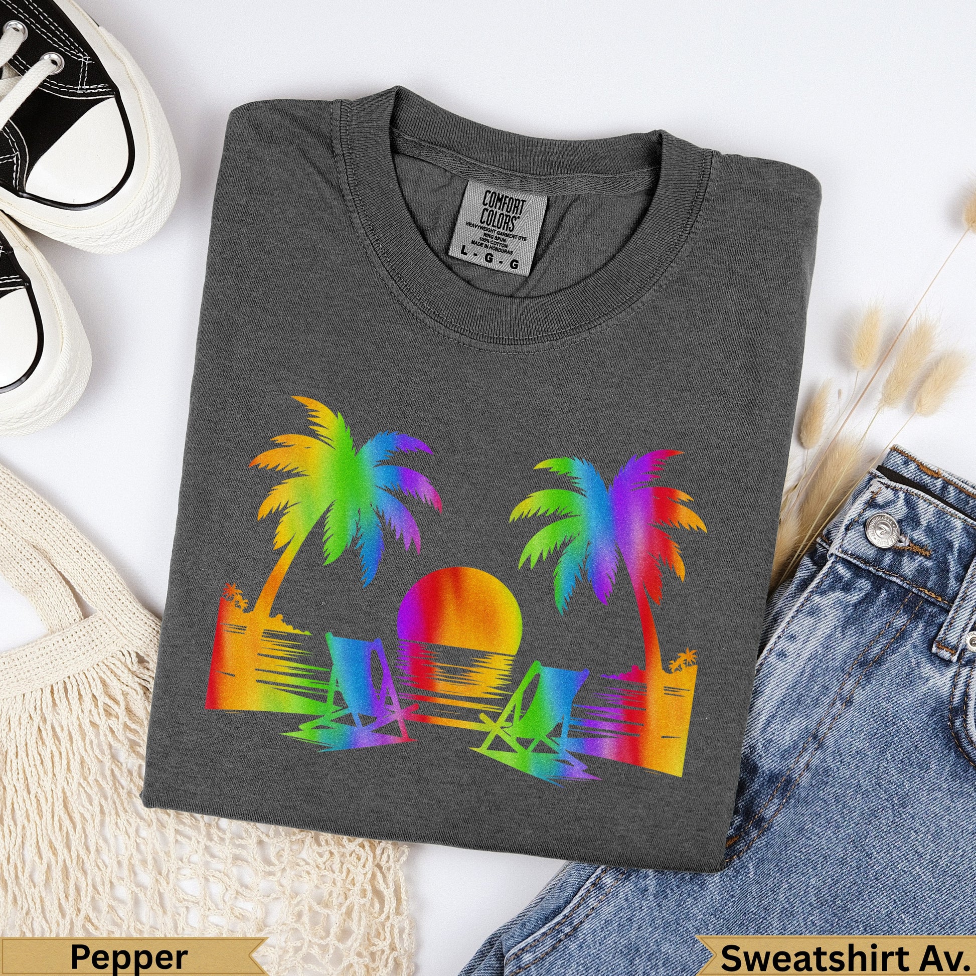 Dark gray t-shirt with rainbow palm trees and beach chairs graphic.