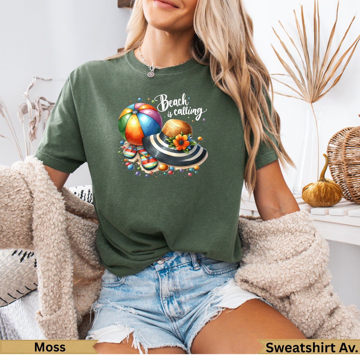 Green t-shirt with "Beach is calling" text, beach ball, and hat graphic.