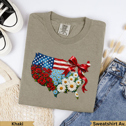 T-shirt featuring a USA flag map design with flowers and a red bow.
