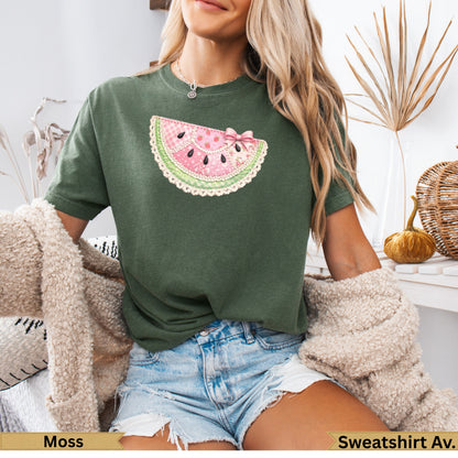 Green t-shirt with pink watermelon slice graphic and "Moss" text below.