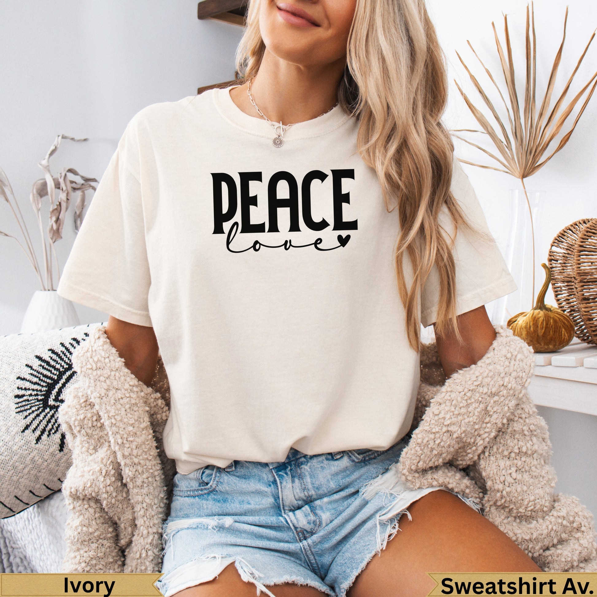 Cream crewneck sweatshirt with "Peace Love" text in black.