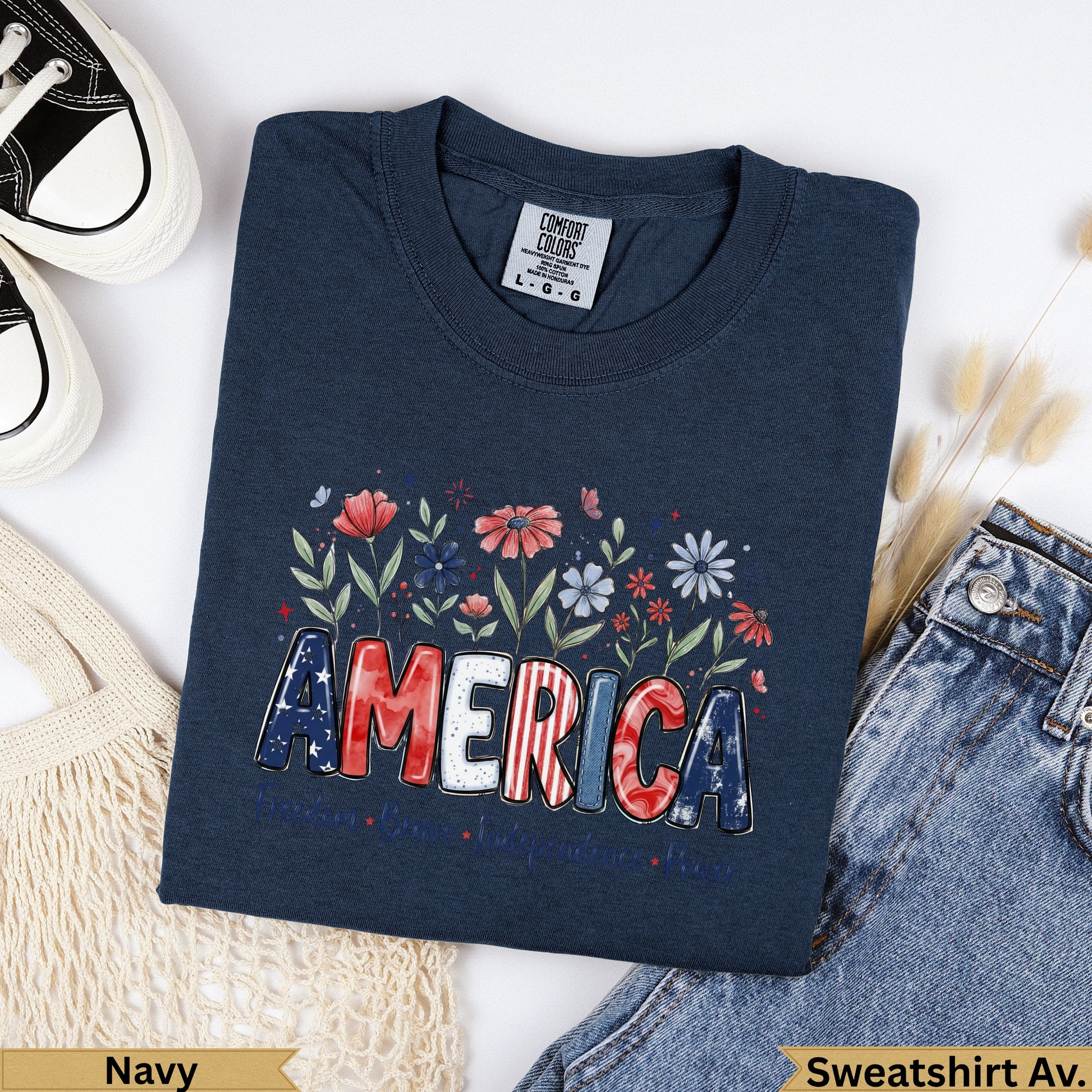 Navy Comfort Colors sweatshirt with "AMERICA" design and floral accents.