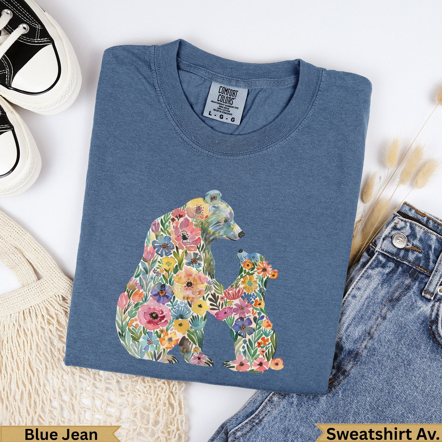 Blue sweatshirt with a colorful floral bear and cub design.