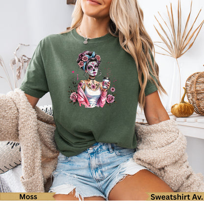 Woman wearing a green graphic t-shirt with a Day of the Dead inspired skeleton design.