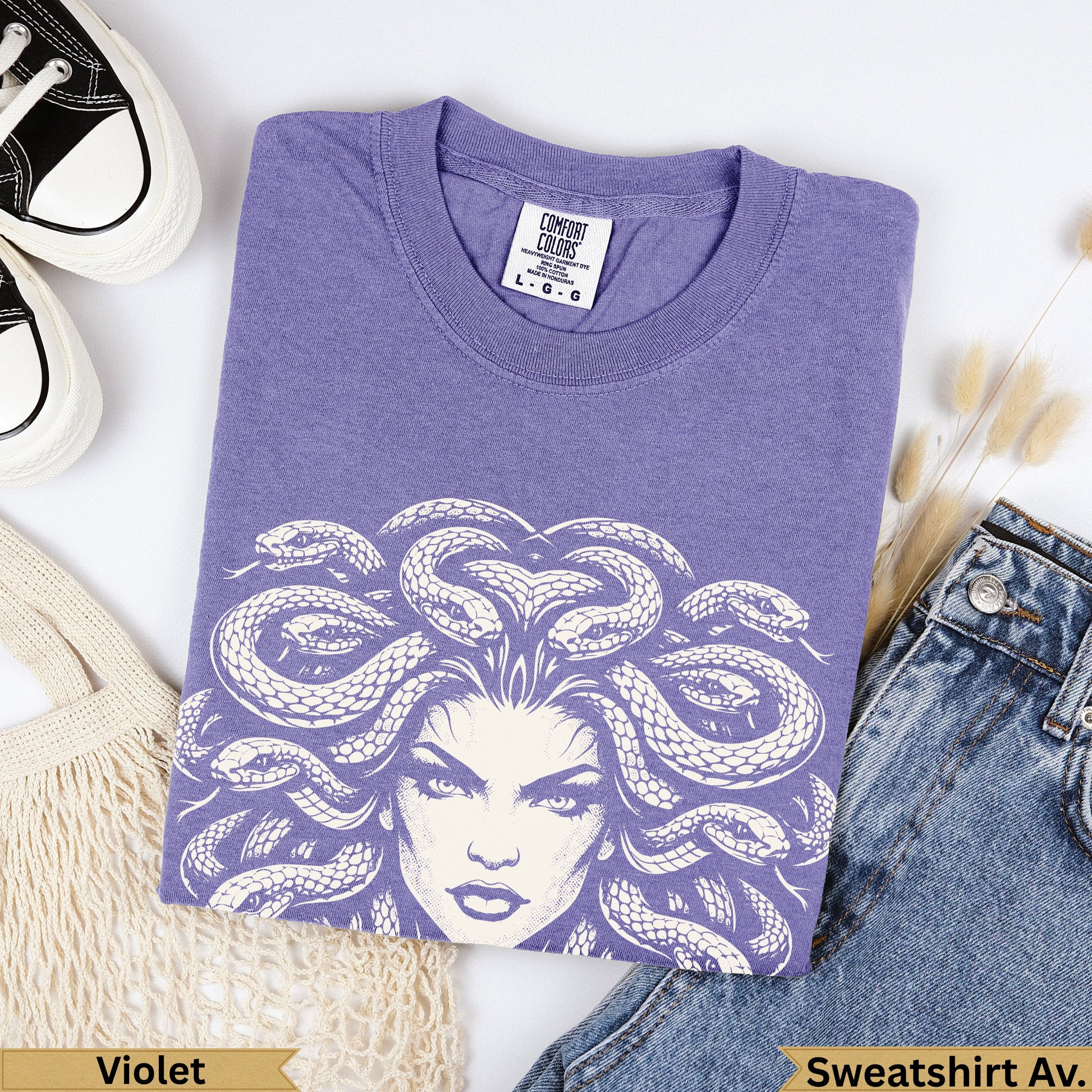 Lavender Comfort Colors sweatshirt with Medusa graphic, and text.