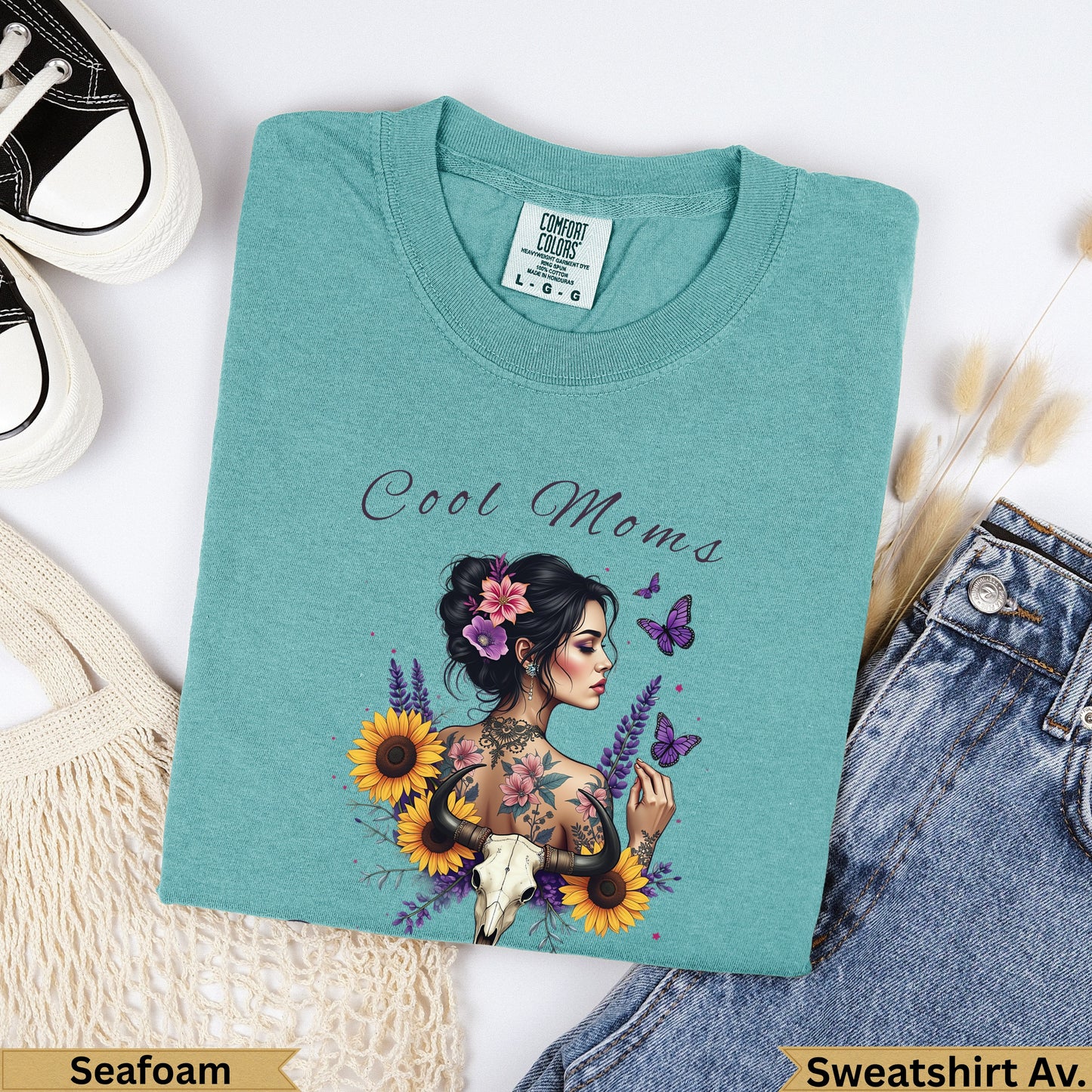 Teal Comfort Colors t-shirt with "Cool Moms" text and floral skull design.