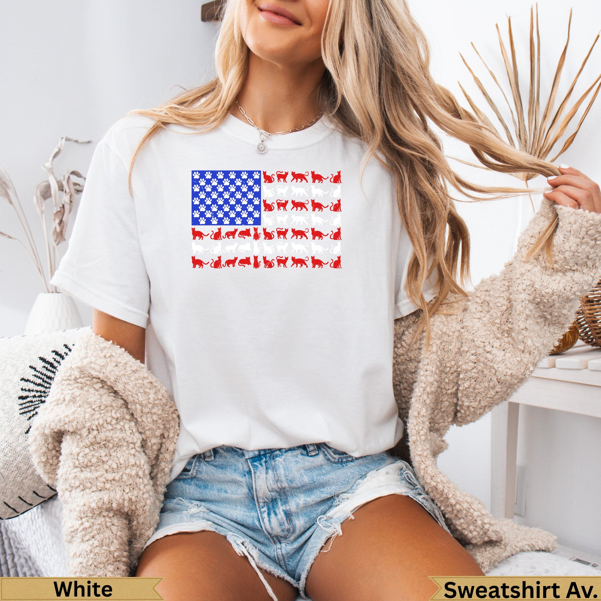 White t-shirt with American flag pattern made of cat silhouettes.