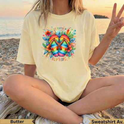 Yellow t-shirt with rainbow flip flops and floral watercolor graphic.