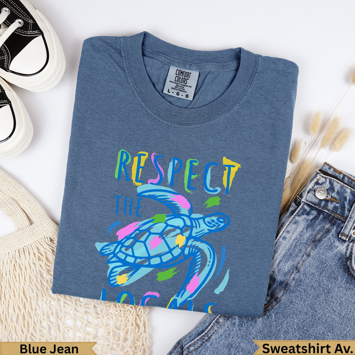 Blue Jean Comfort Colors t-shirt with colorful sea turtle and text "RESPECT THE OCEAN".