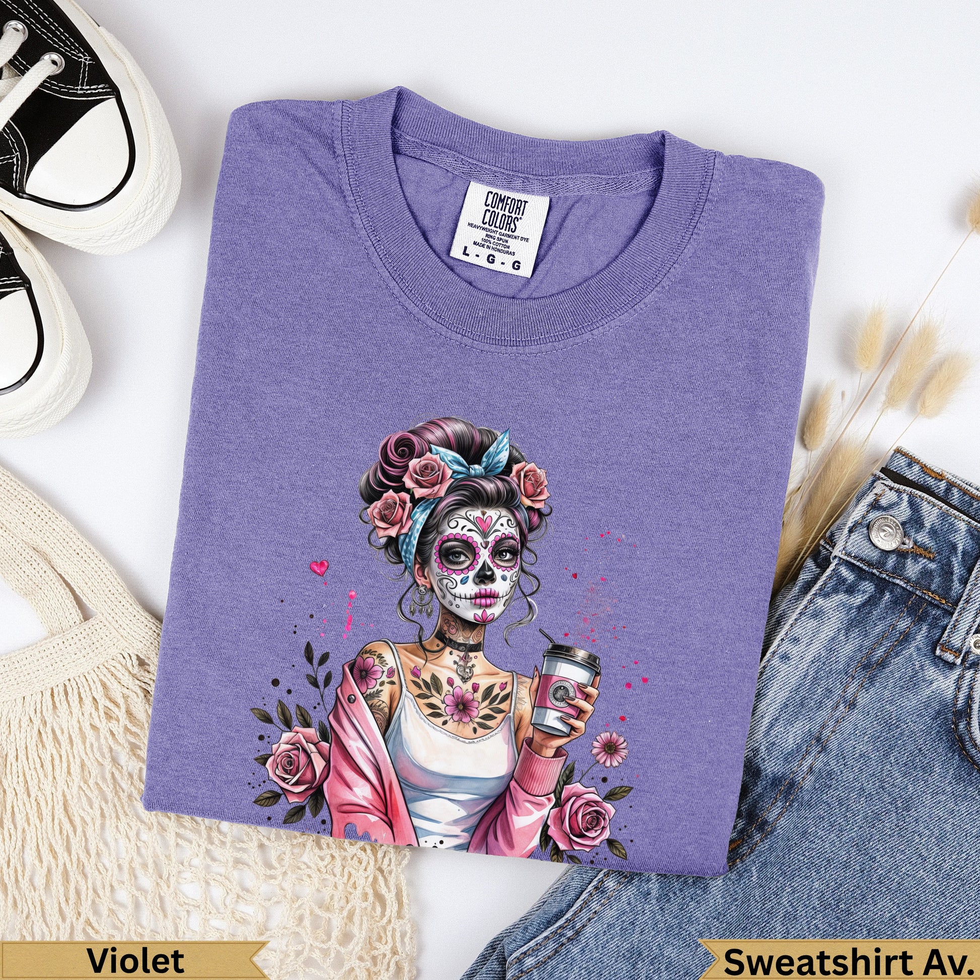 Purple t-shirt with a Day of the Dead inspired woman holding a coffee cup.