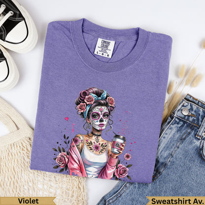 Purple t-shirt with a Day of the Dead inspired woman holding a coffee cup.