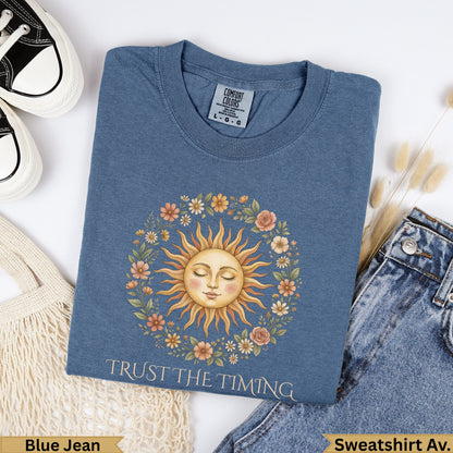 Blue Jean sweatshirt with sun and floral wreath graphic, "Trust the Timing".