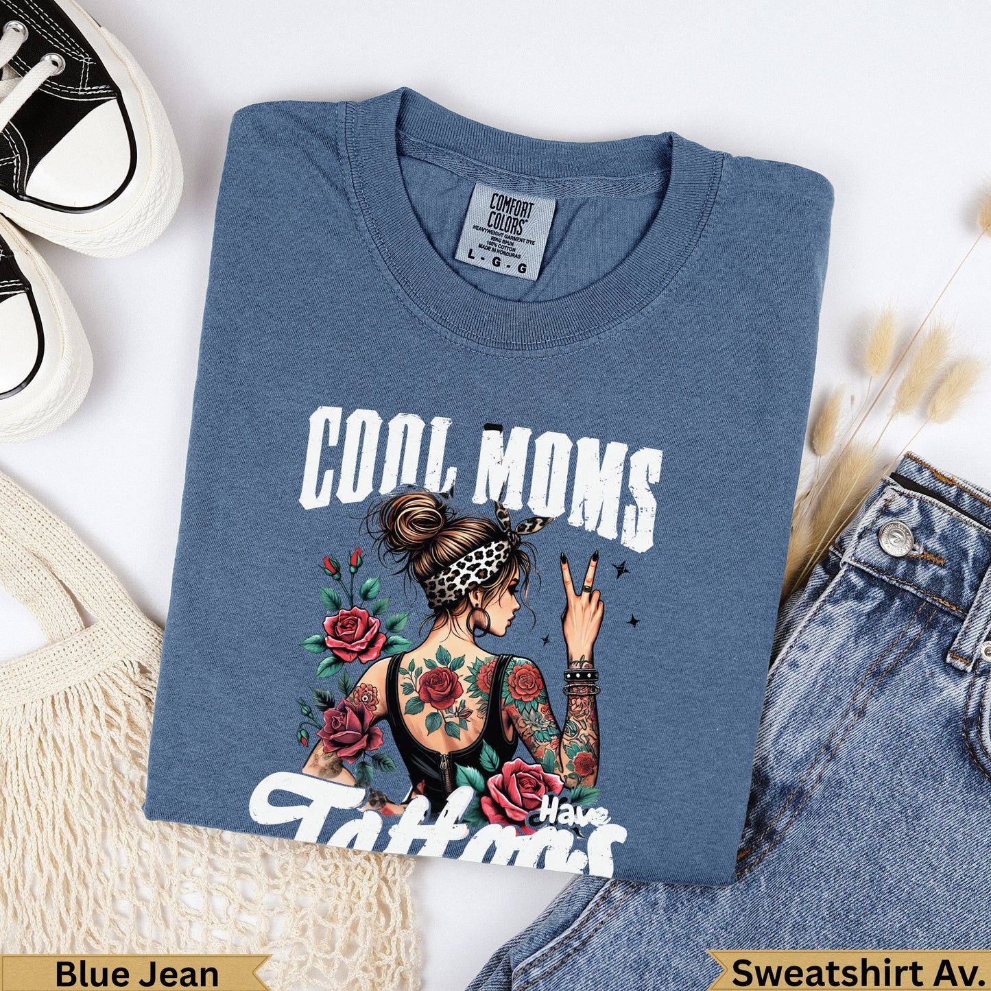 Blue jean sweatshirt with "Cool Moms Have Tattoos" graphic and roses.
