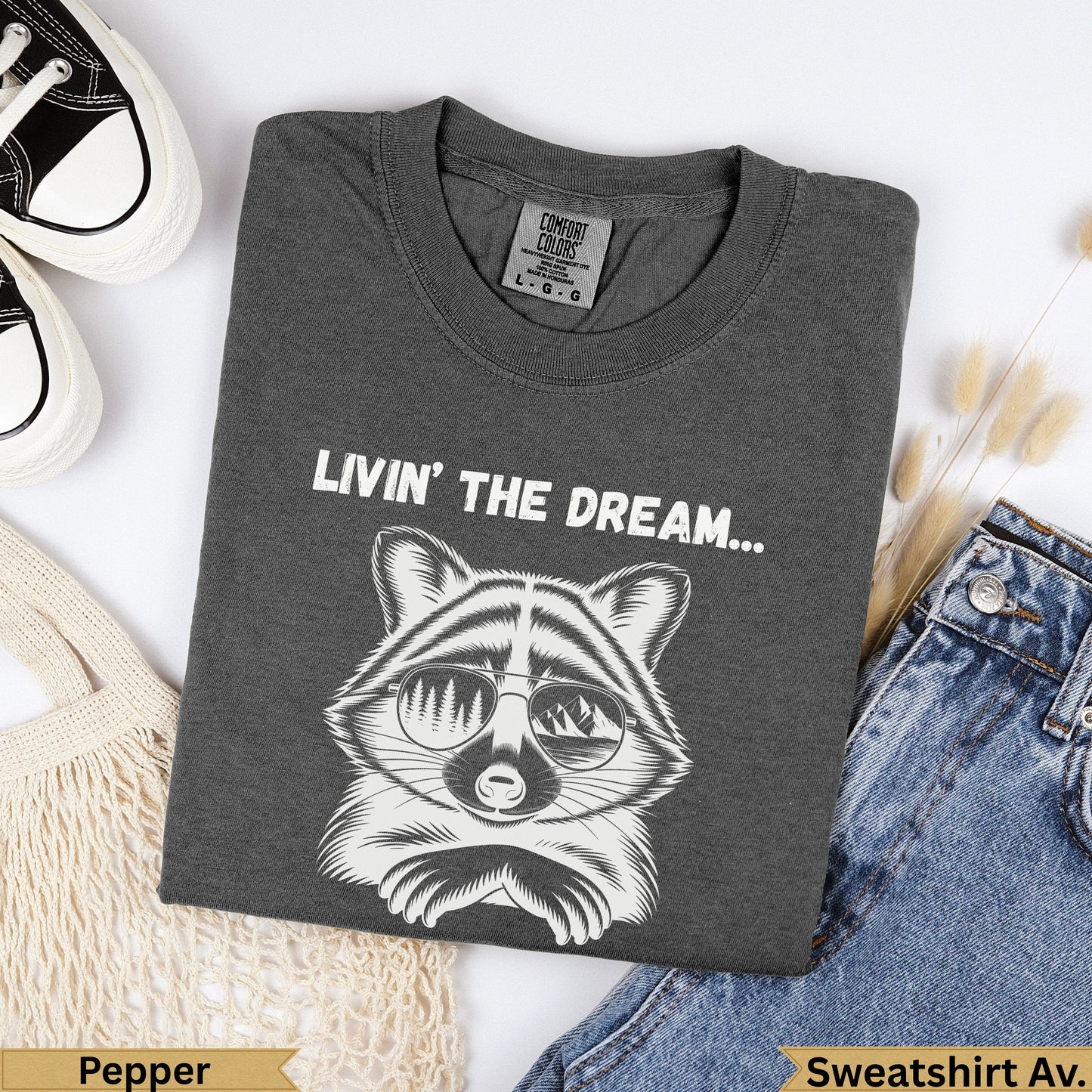 Dark grey t-shirt with raccoon graphic and "Livin' The Dream" text.
