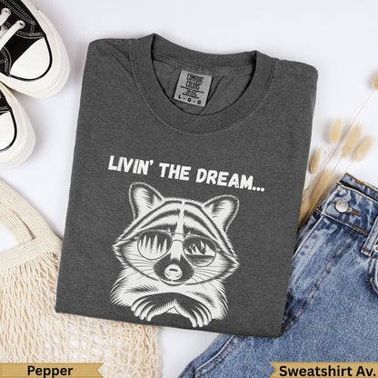 Dark grey t-shirt with raccoon graphic and "Livin' The Dream" text.
