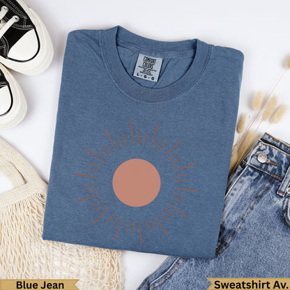 Blue Jean Comfort Colors sweatshirt with a coral sun graphic.