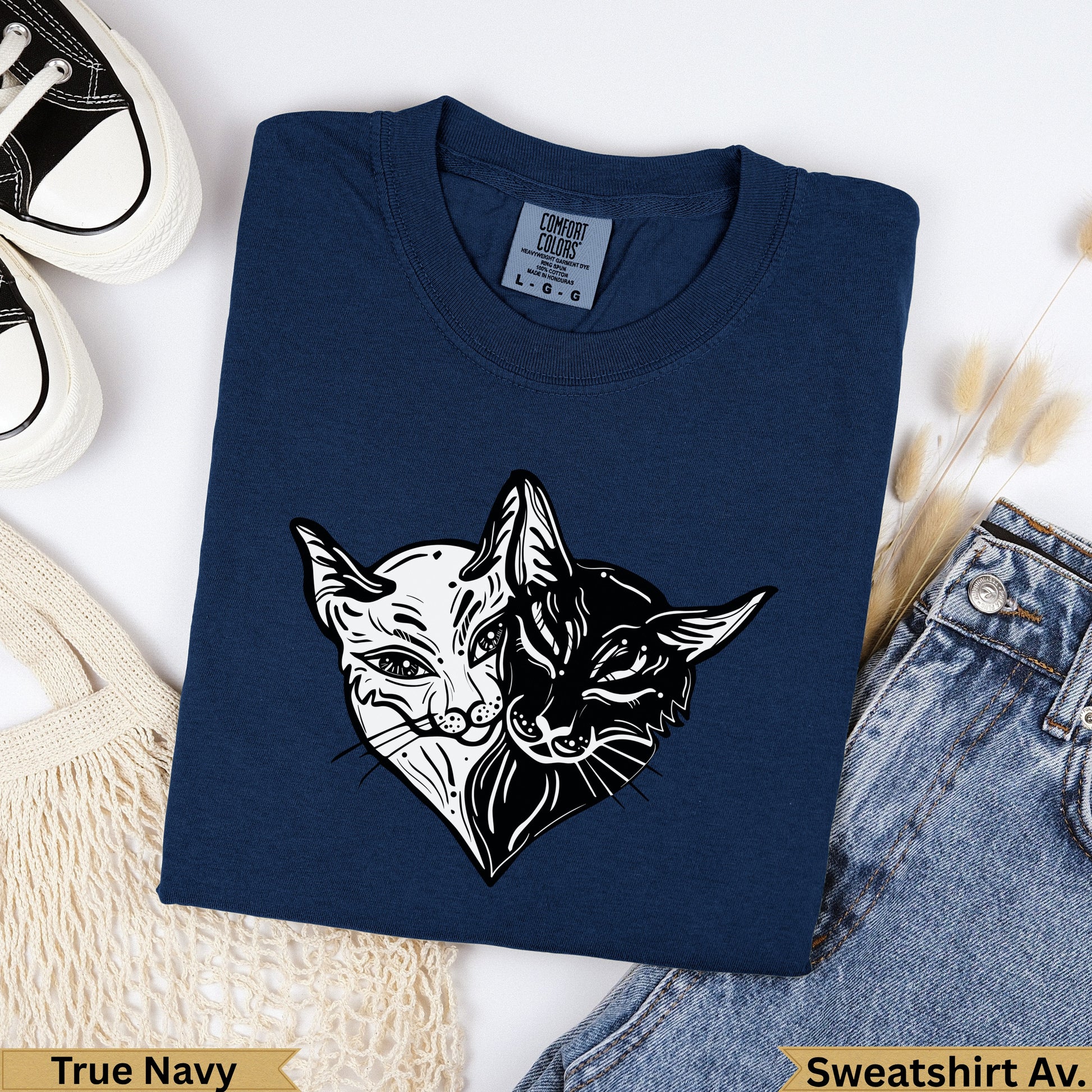 Navy t-shirt with a split cat graphic, True Navy color label.