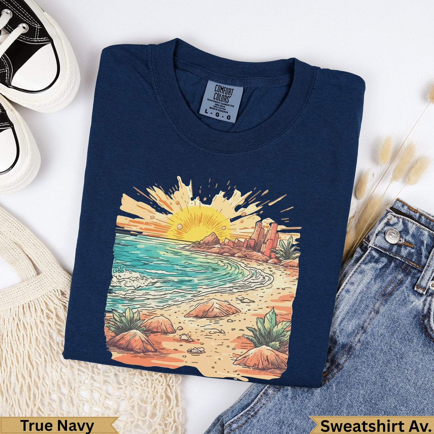 Dark navy t-shirt with beach sunset graphic, text "True Navy" and "Sweatshirt Av."