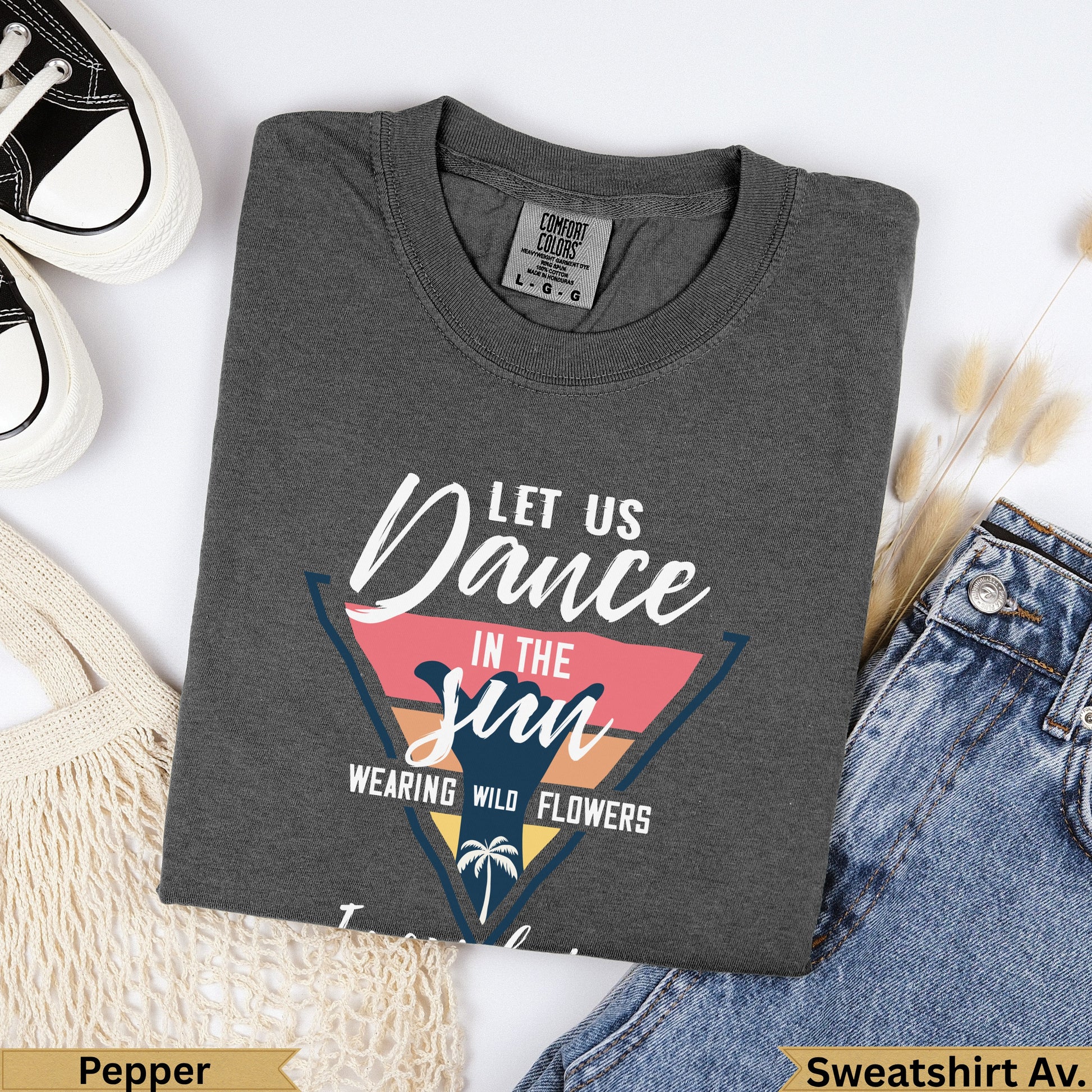 Dark grey t-shirt with "Let Us Dance in the Sun Wearing Wild Flowers" graphic.