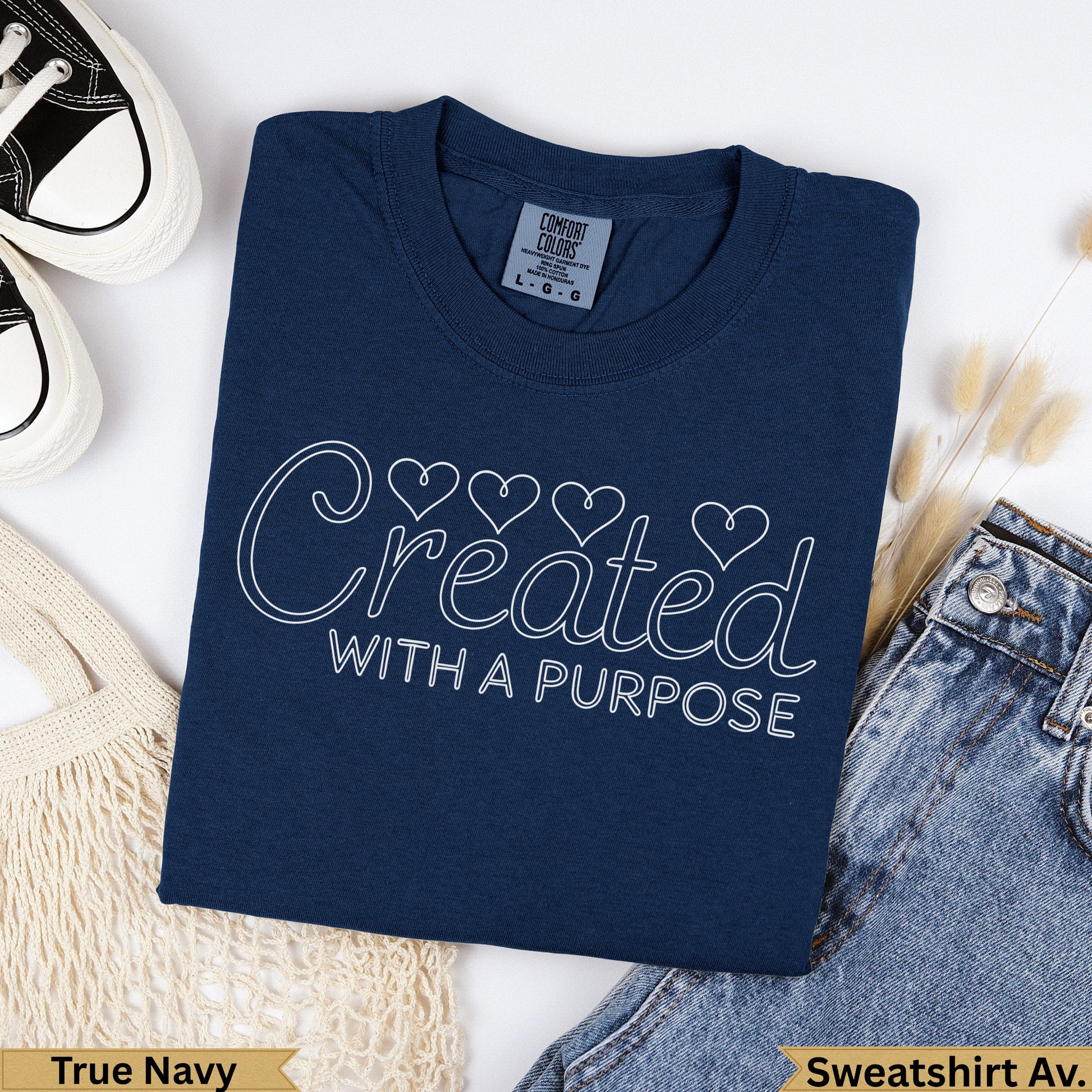 Navy blue t-shirt with "Created WITH A PURPOSE" text and heart outlines.