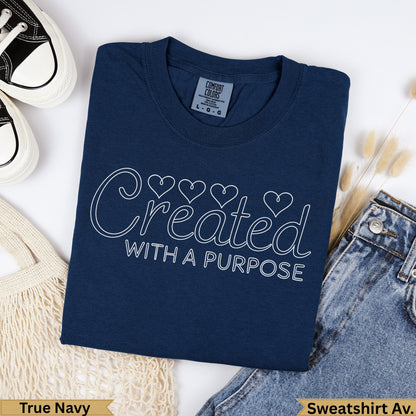 Navy blue t-shirt with "Created WITH A PURPOSE" text and heart outlines.