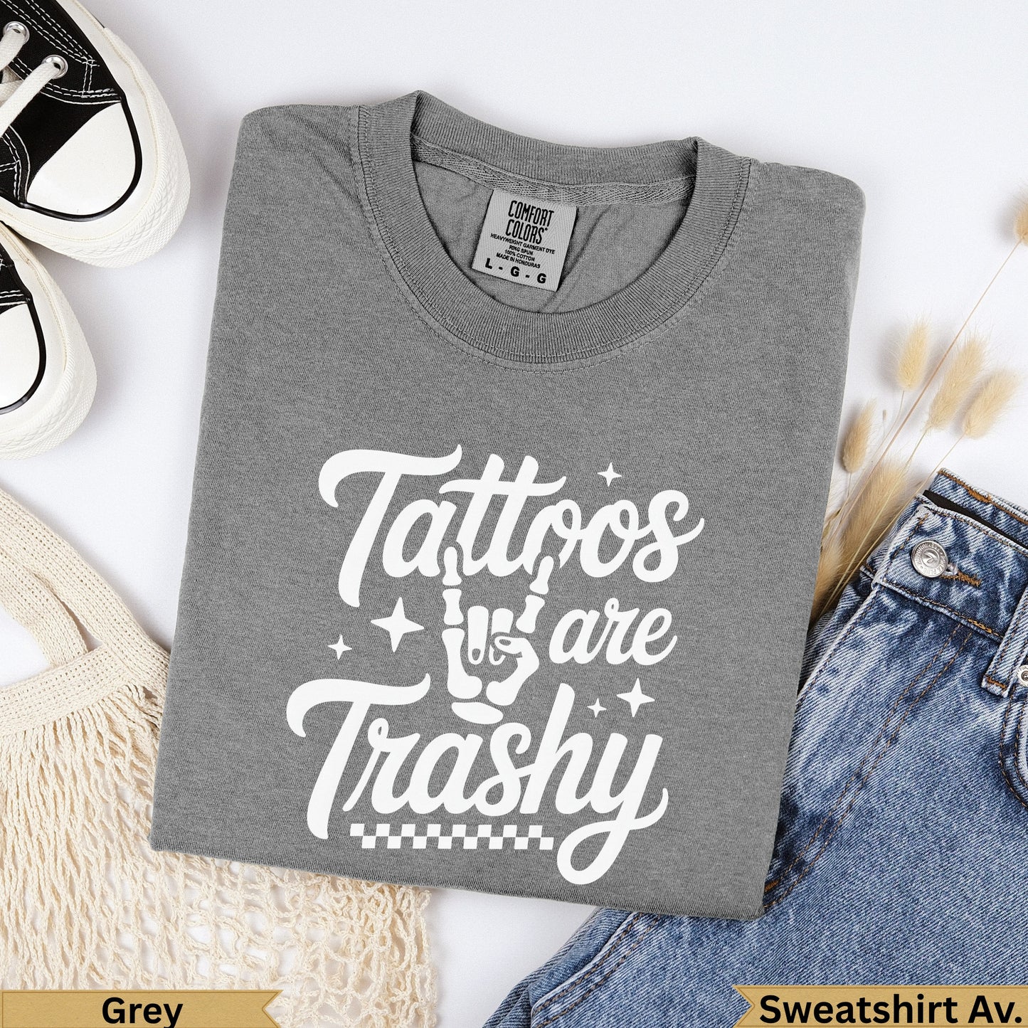 Grey t-shirt with "Tattoos are Trashy" text and checkered pattern.