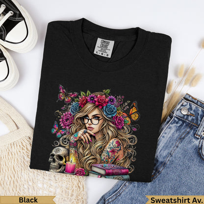 Black Comfort Colors sweatshirt with floral skull and tattooed woman design.