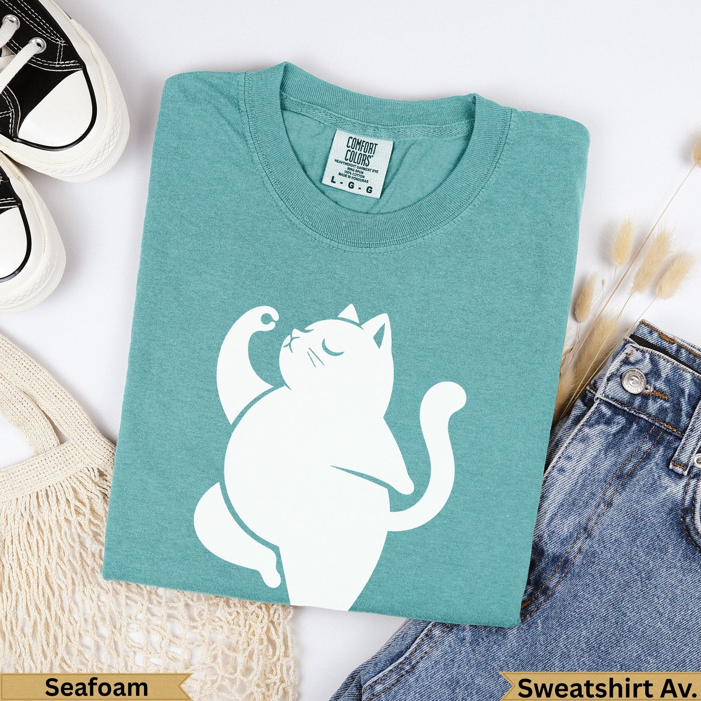 Teal Comfort Colors sweatshirt with white cat graphic, "Seafoam" and "Sweatshirt Av." text.