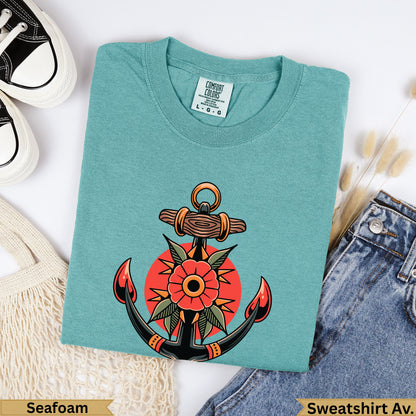Teal sweatshirt with traditional anchor and flower tattoo design.
