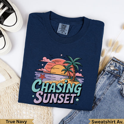 Navy sweatshirt with "Chasing Sunset" text and tropical beach graphic.