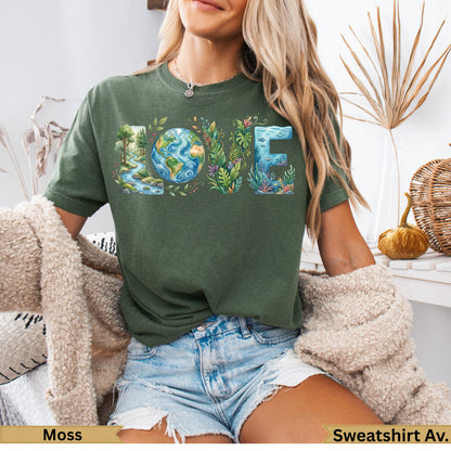 Olive green t-shirt with "LOVE" design incorporating nature and earth elements.