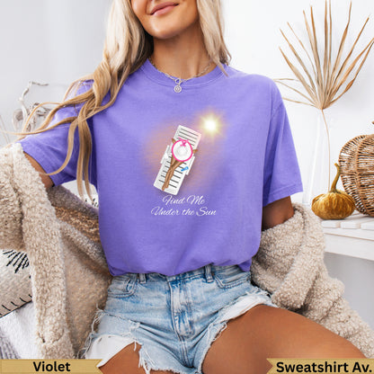 Purple t-shirt with "Find Me Under the Sun" text and beach chair graphic.